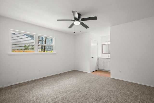 2109 Brandywine Ln, Austin, TX 78727 - unfurnished bedroom with light colored carpet, ensuite bath, and a ceiling fan
