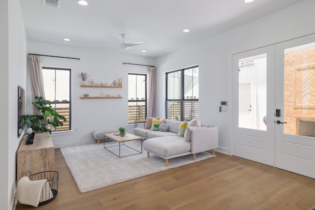 3108 Chennault St, Austin, TX 78723 - living room with french doors, wood finished floors, a ceiling fan, and recessed lighting