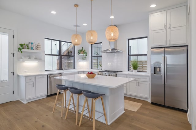 3108 Chennault St, Austin, TX 78723 - kitchen with stainless steel appliances, open shelves, plenty of natural light, white cabinets, and recessed lighting