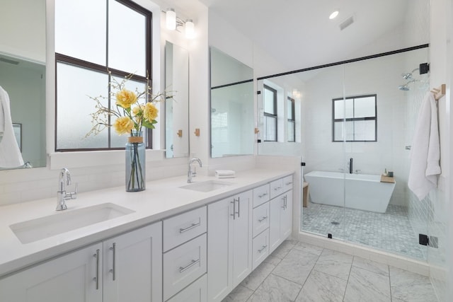 3108 Chennault St, Austin, TX 78723 - full bath featuring marble finish flooring, double vanity, a soaking tub, and a shower stall