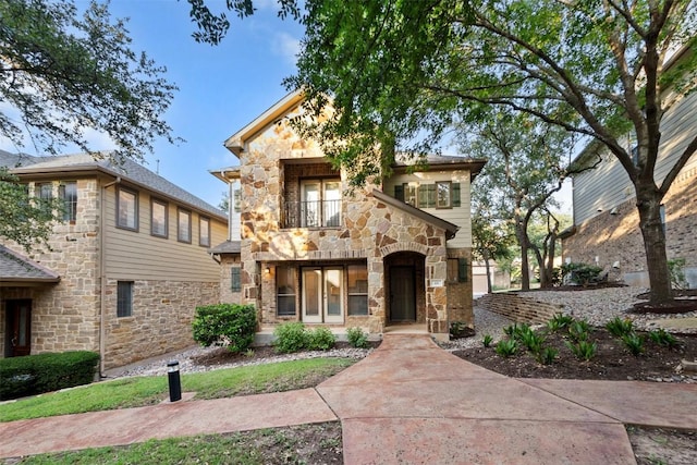 11400 W Parmer Ln Unit 44, Cedar Park, TX 78613 - view of front facade featuring stone siding and a balcony