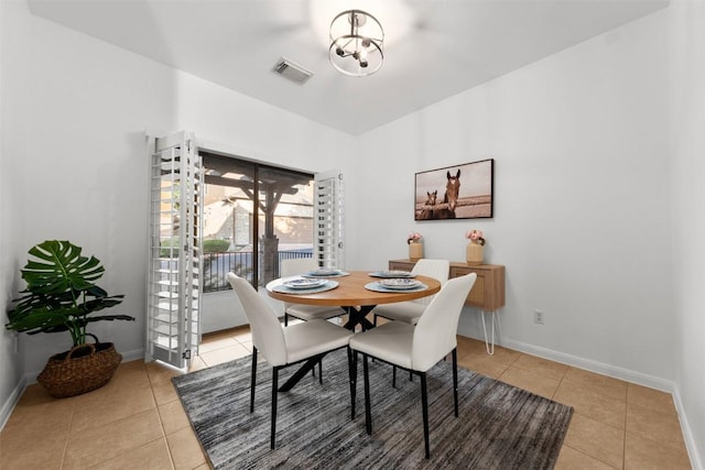 11400 W Parmer Ln Unit 44, Cedar Park, TX 78613 - dining space with light tile patterned floors and a chandelier
