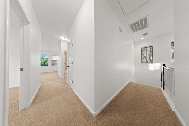 11400 W Parmer Ln Unit 44, Cedar Park, TX 78613 - corridor featuring light colored carpet, attic access, and an upstairs landing