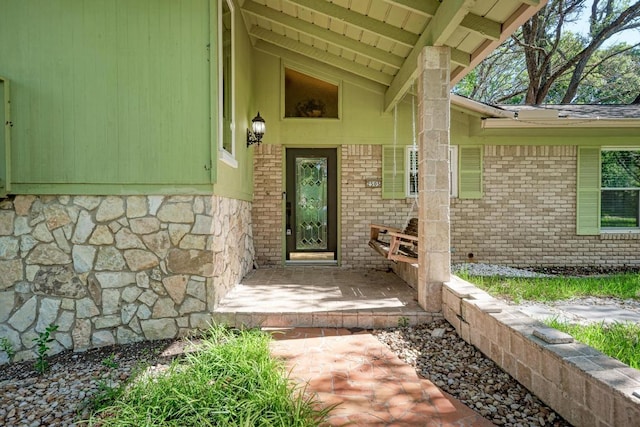 2505 Linwood Rd, Temple, TX 76502 - property entrance featuring stone siding, a porch, and brick siding
