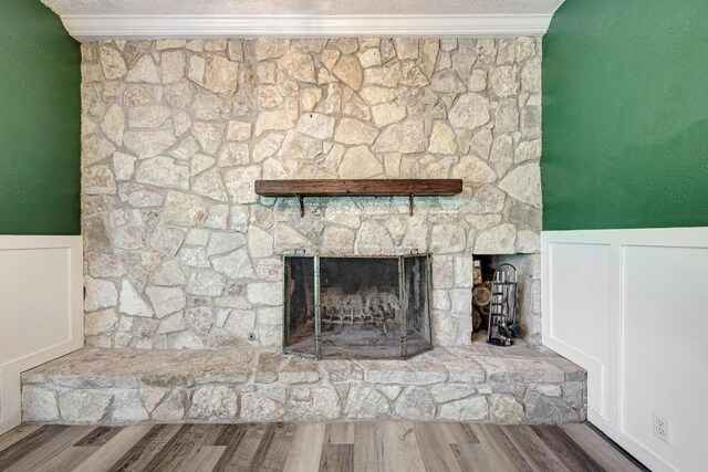 2505 Linwood Rd, Temple, TX 76502 - detailed view of wainscoting, a fireplace, and wood finished floors