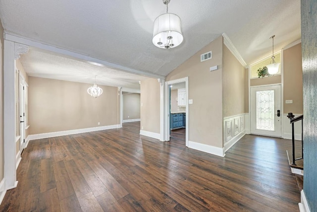 2505 Linwood Rd, Temple, TX 76502 - foyer with a chandelier, dark wood-style floors, a textured ceiling, high vaulted ceiling, and crown molding
