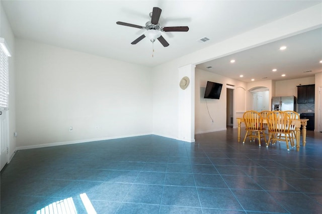 13903 Cantata Ln, Austin, TX 78660 - dining space with arched walkways, recessed lighting, dark tile patterned flooring, and a ceiling fan