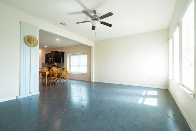 13903 Cantata Ln, Austin, TX 78660 - living area with a ceiling fan, dark tile patterned flooring, and recessed lighting