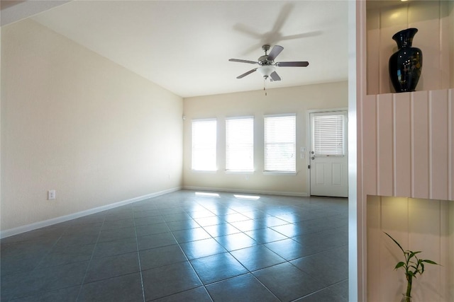13903 Cantata Ln, Austin, TX 78660 - empty room with ceiling fan and dark tile patterned floors