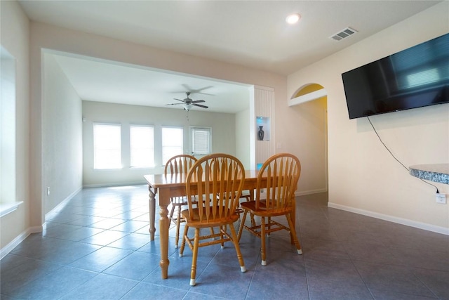 13903 Cantata Ln, Austin, TX 78660 - dining space with arched walkways, a ceiling fan, tile patterned floors, and recessed lighting