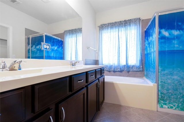 13903 Cantata Ln, Austin, TX 78660 - full bathroom featuring double vanity, a bath, tile patterned floors, and a shower