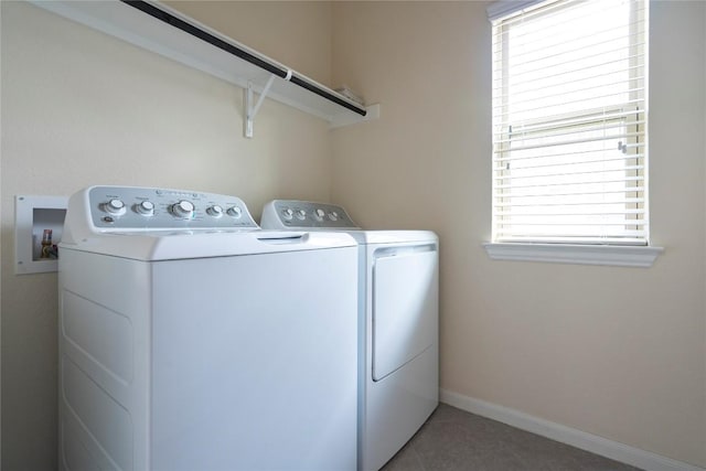 13903 Cantata Ln, Austin, TX 78660 - laundry area with washer and clothes dryer, healthy amount of natural light, and tile patterned flooring