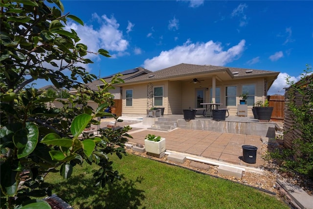 13903 Cantata Ln, Austin, TX 78660 - rear view of house featuring ceiling fan, a patio, and solar panels