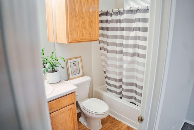 12805 Briarcreek Loop, Manor, TX 78653 - full bathroom with vanity, wood finished floors, and shower / bath combo with shower curtain