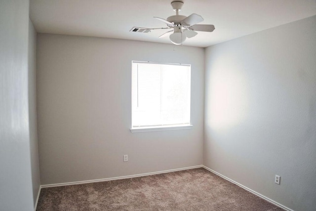 12805 Briarcreek Loop, Manor, TX 78653 - carpeted empty room with plenty of natural light and ceiling fan