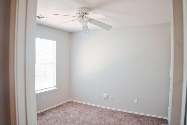 12805 Briarcreek Loop, Manor, TX 78653 - carpeted spare room featuring ceiling fan and baseboards