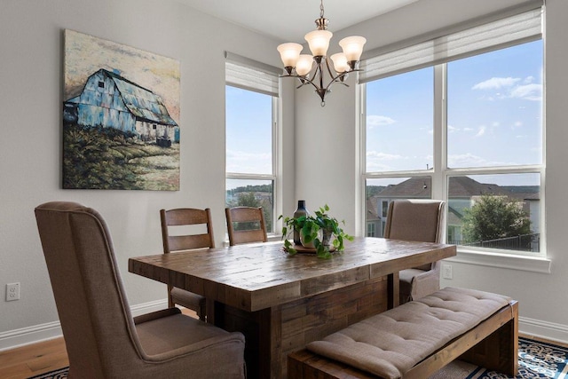 4509 Port Bari Dr, Leander, TX 78641 - dining space featuring a chandelier and wood finished floors