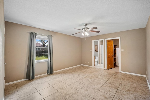 206 Woodland Trl, Belton, TX 76513 - empty room featuring a ceiling fan, light tile patterned floors, and a textured ceiling