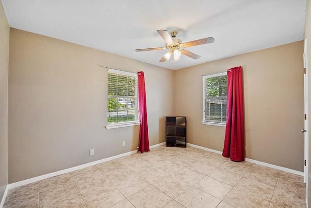 206 Woodland Trl, Belton, TX 76513 - unfurnished room featuring plenty of natural light, ceiling fan, and light tile patterned floors