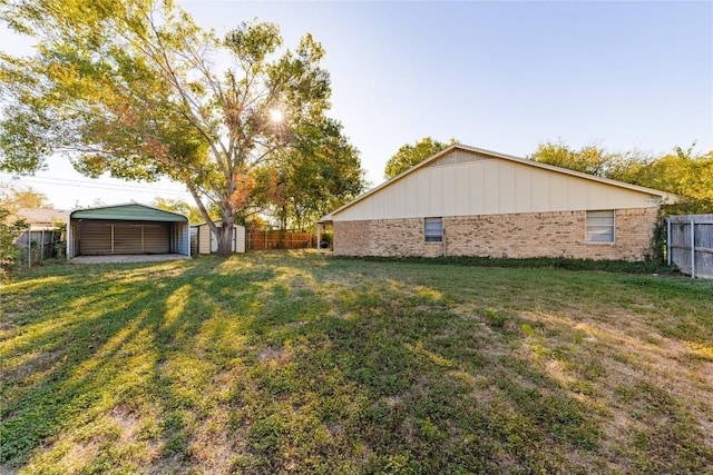 206 Woodland Trl, Belton, TX 76513 - fenced backyard featuring a carport and a storage unit