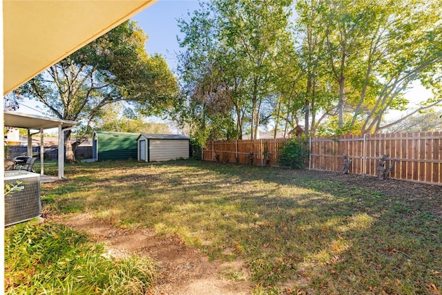 206 Woodland Trl, Belton, TX 76513 - fenced backyard with a storage unit