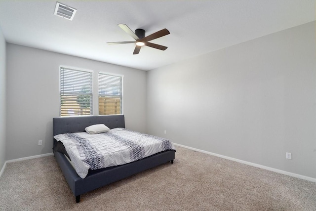 12003 Curlin Cv, Buda, TX 78610 - carpeted bedroom featuring baseboards and a ceiling fan
