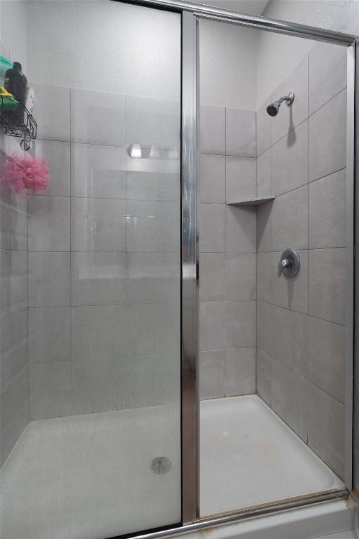 12003 Curlin Cv, Buda, TX 78610 - full bath featuring a stall shower