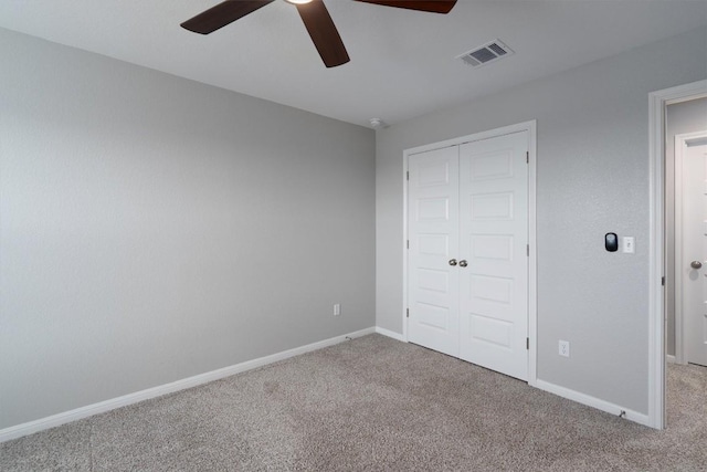 12003 Curlin Cv, Buda, TX 78610 - unfurnished bedroom with carpet flooring, a closet, and a ceiling fan