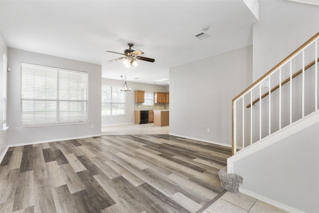 9405 Billingham Trl, Austin, TX 78717 - unfurnished living room featuring stairs, light wood finished floors, and ceiling fan