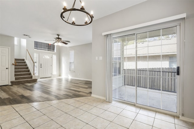 9405 Billingham Trl, Austin, TX 78717 - foyer with stairway, light wood finished floors, a chandelier, and ceiling fan