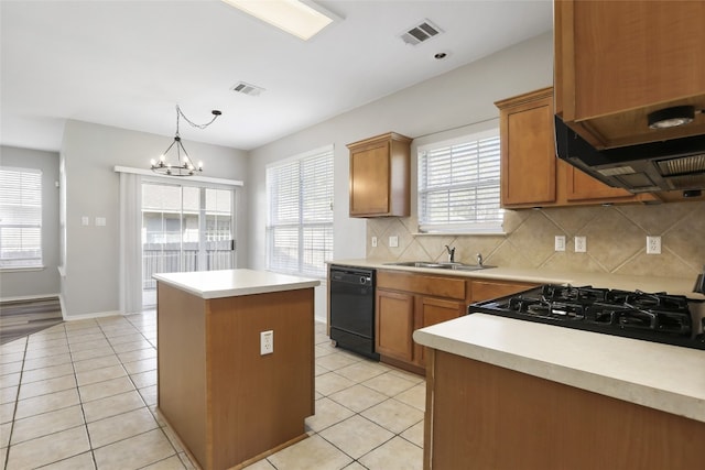 9405 Billingham Trl, Austin, TX 78717 - kitchen with dishwasher, light tile patterned floors, a kitchen island, and tasteful backsplash