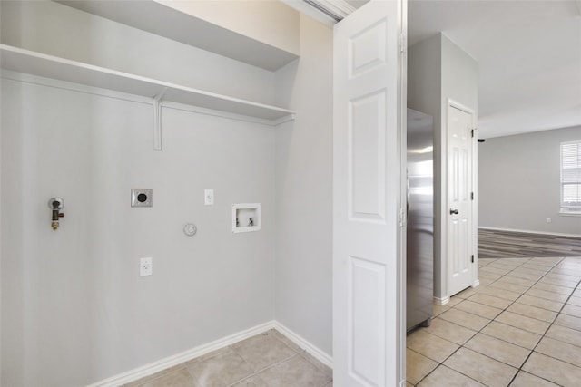 9405 Billingham Trl, Austin, TX 78717 - washroom featuring electric dryer hookup, hookup for a gas dryer, light tile patterned floors, and hookup for a washing machine