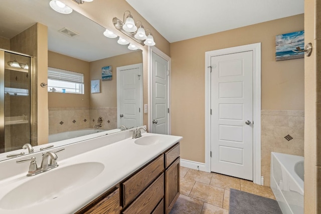 198 Sheridan Loop, Belton, TX 76513 - bathroom with a bath, double vanity, a stall shower, and tile patterned floors