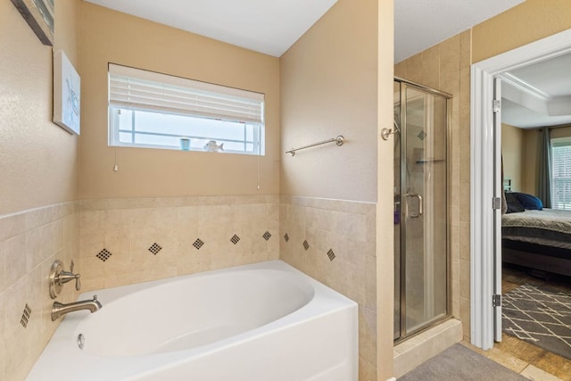 198 Sheridan Loop, Belton, TX 76513 - full bathroom featuring ensuite bathroom, a bath, healthy amount of natural light, and a shower stall