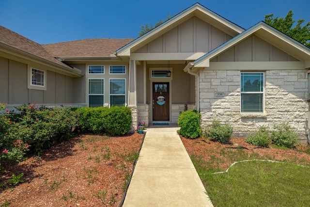 198 Sheridan Loop, Belton, TX 76513 - entrance to property featuring board and batten siding, stone siding, and roof with shingles