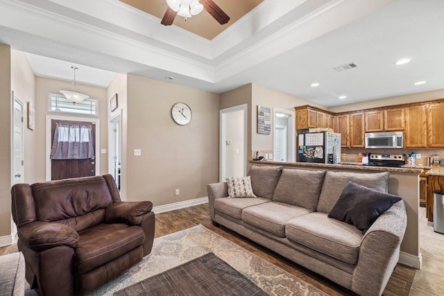 198 Sheridan Loop, Belton, TX 76513 - living area featuring ceiling fan, light wood-type flooring, crown molding, recessed lighting, and a raised ceiling