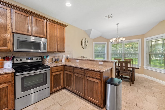198 Sheridan Loop, Belton, TX 76513 - kitchen featuring appliances with stainless steel finishes, vaulted ceiling, decorative backsplash, a peninsula, and a chandelier