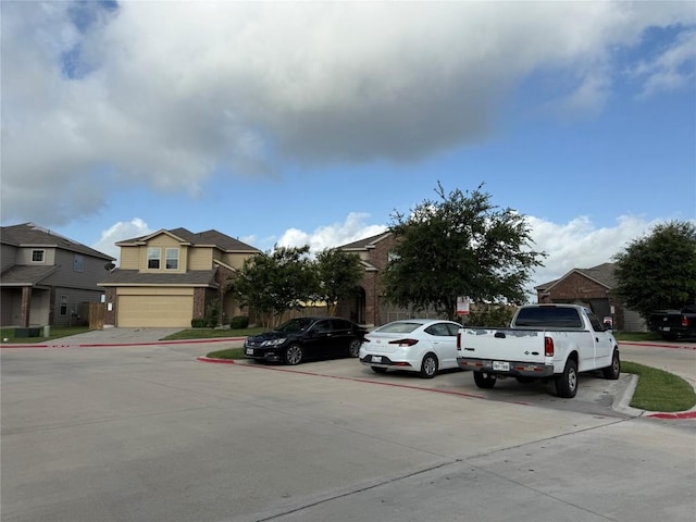 352 Circle Way Unit 37E, Jarrell, TX 76537 - uncovered parking lot with a residential view