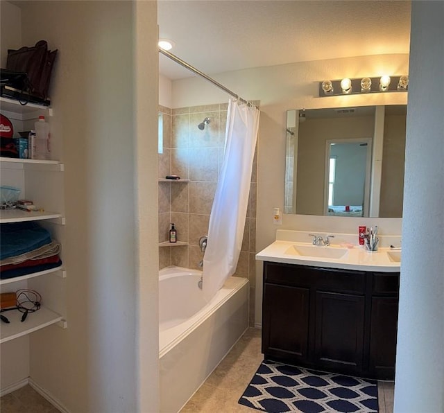 352 Circle Way Unit 37E, Jarrell, TX 76537 - bathroom featuring shower / tub combo with curtain and vanity