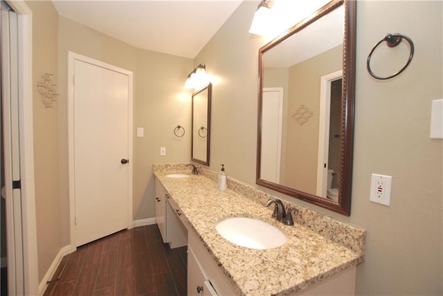 11724 Running Fox Trl, Austin, TX 78759 - bathroom with double vanity and wood finished floors