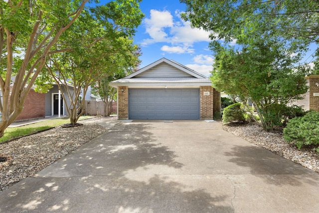 2127 Redwing Way, Round Rock, TX 78664 - view of front of house featuring brick siding, a garage, and driveway