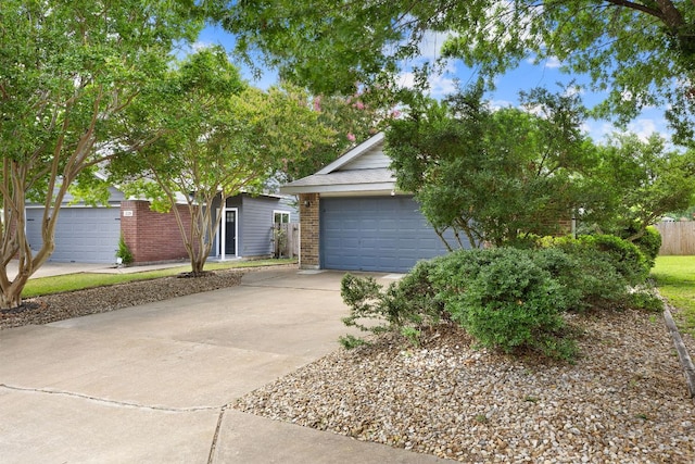 2127 Redwing Way, Round Rock, TX 78664 - obstructed view of property with driveway and brick siding