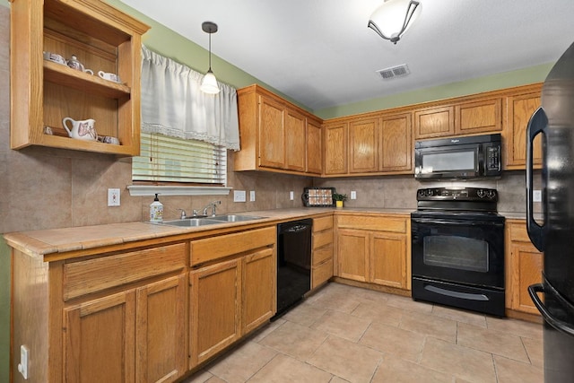 2127 Redwing Way, Round Rock, TX 78664 - kitchen with black appliances, tasteful backsplash, pendant lighting, and open shelves
