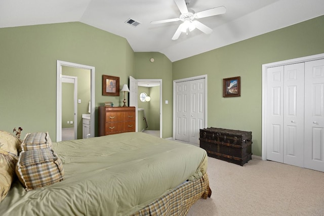 2127 Redwing Way, Round Rock, TX 78664 - carpeted bedroom featuring two closets, lofted ceiling, connected bathroom, and a ceiling fan