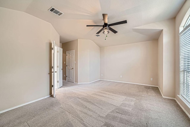 17714 Limpia Crk, Round Rock, TX 78664 - carpeted empty room featuring ceiling fan, vaulted ceiling, and healthy amount of natural light