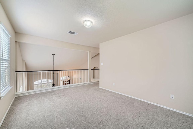 17714 Limpia Crk, Round Rock, TX 78664 - carpeted spare room featuring baseboards and a textured ceiling
