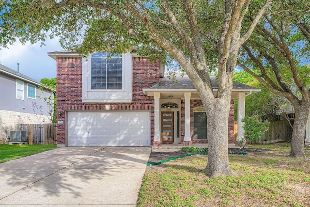 17714 Limpia Crk, Round Rock, TX 78664 - view of front of property featuring brick siding, a garage, driveway, and roof with shingles