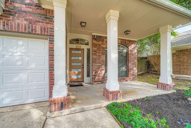 17714 Limpia Crk, Round Rock, TX 78664 - doorway to property with brick siding, covered porch, and an attached garage