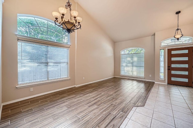 17714 Limpia Crk, Round Rock, TX 78664 - entryway with a chandelier, light wood-style floors, and high vaulted ceiling