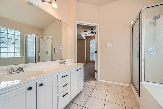 17714 Limpia Crk, Round Rock, TX 78664 - full bath featuring ceiling fan, a stall shower, double vanity, and tile patterned floors